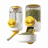 Load image into Gallery viewer, A modern yellow and white automatic rabbit feeder and gravity water dispenser set designed for cage mounting, showcasing the food pellet bin and a small animal water bottle.
