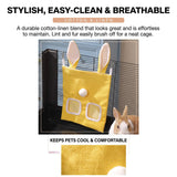 Load image into Gallery viewer, A stylish and easy-clean cotton-linen rabbit grass pellet dispenser in yellow, hanging in a wire cage with a Holland Lop, featuring breathable fabric to keep pets cool.