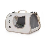 Load image into Gallery viewer, Soft-sided breathable rabbit travel carrier in light beige featuring side ventilation mesh panel, three air grommets, top handle, and adjustable shoulder strap.