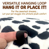 Load image into Gallery viewer, Hand demonstrating the sturdy top fabric loop on a spotted plush bunny bed for flexible cage positioning.
