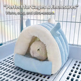Load image into Gallery viewer, Lop bunny resting comfortably inside the blue antler fleece cave bed set up on a plastic slotted floor inside an indoor pet wire cage enclosure.