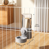 Load image into Gallery viewer, Indoor setup view of the hanging automatic bunny water bowl feeder attached securely to a wire enclosure panel with size specifications.