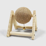 Load image into Gallery viewer, Side perspective view of the solid wood rabbit scratching ball toy with hanging bell for interactive indoor play.