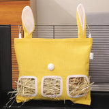 Load image into Gallery viewer, A medium-sized yellow rabbit grass pellet feeder bag with bunny ears, featuring three dispensing windows filled with grass pellets for multiple small pets.