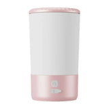 Load image into Gallery viewer, Pink electric paw cleaner cup with soft silicone bristles designed for pet bunnies and small animal grooming.