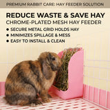 Load image into Gallery viewer, A close-up photograph of a adorable brown and black lop-eared rabbit in a wire cage, happily eating hay from a pink plastic hay feeder dispenser. A text overlay features key benefits like "REDUCE WASTE &amp; SAVE HAY" and "CHROME-PLATED MESH HAY FEEDER"