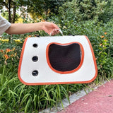 Load image into Gallery viewer, Woman holding the lightweight rabbit travel tote with orange trim outdoors by the handle, featuring side air grommets and front viewing mesh.