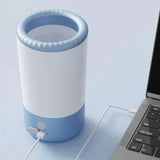 Load image into Gallery viewer, Portable rechargeable rabbit paw washer connected to a laptop via USB cable for easy charging.