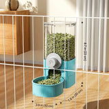 Load image into Gallery viewer, Teal blue hanging gravity rabbit feeder loaded with timothy hay pellets on a playpen panel, with dimension specs of 8.7 inches in height and 3.9 inches width.