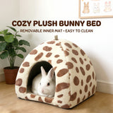Load image into Gallery viewer, Fluffy white rabbit resting inside a soft spotted bunny bed with a removable, easy-to-clean inner mat.