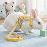 Load image into Gallery viewer, A white bunny exploring safely on a blue rug, wearing a yellow escape-proof rabbit walking vest and matching 78-inch leash.